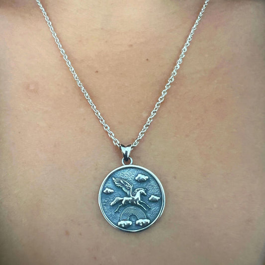 pegasass pendant with pegasus flying through a rainbow in oxidised 925 silver.