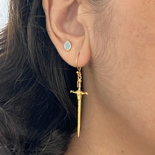 queen of roses excalibur earrings in 24kt gold vermeil modelled on an ear.