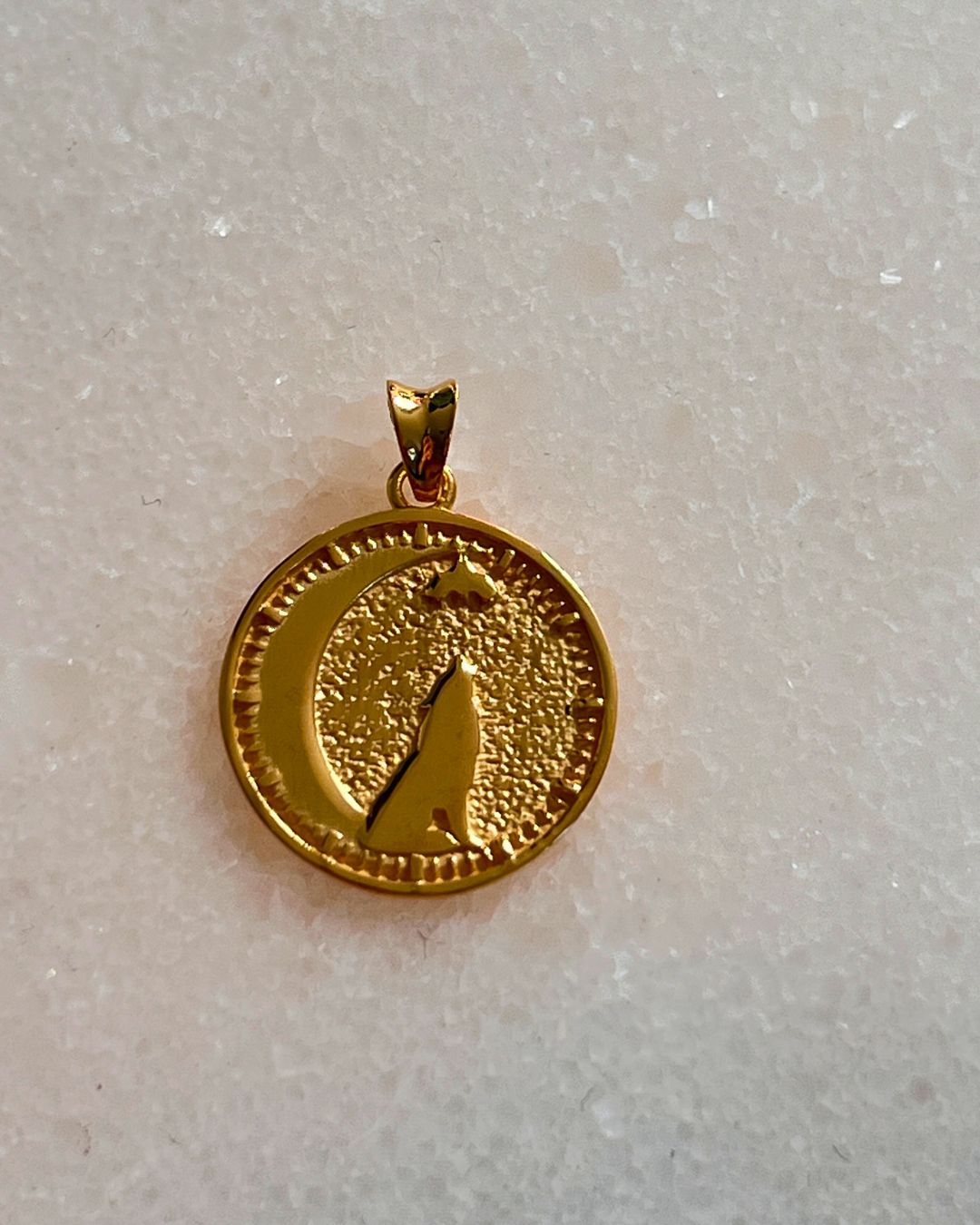 seth on the moon pendant with a wolf and bat on a crescent moon in 24kt gold vermeil. 