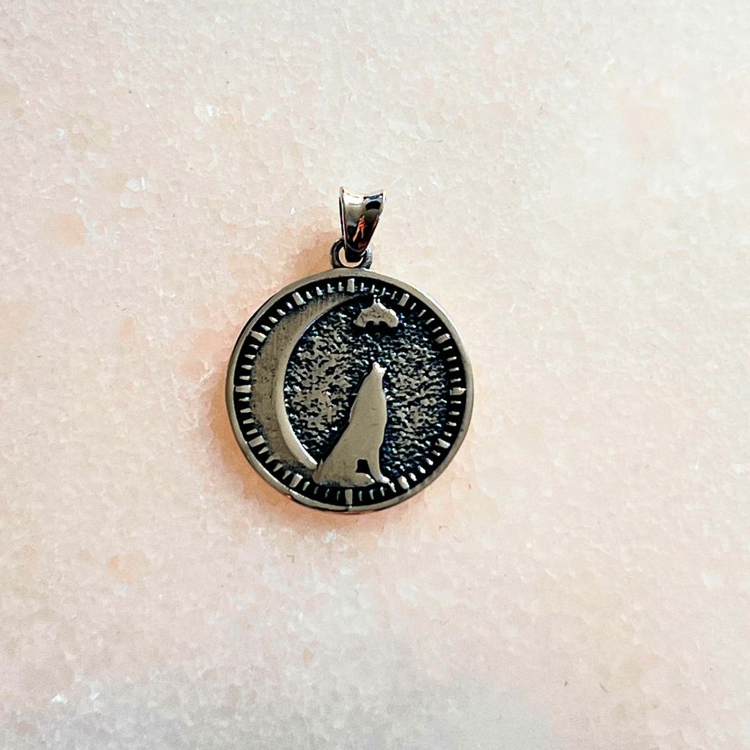 seth on the moon pendant with a wolf and bat on a crescent moon in 925 silver. 